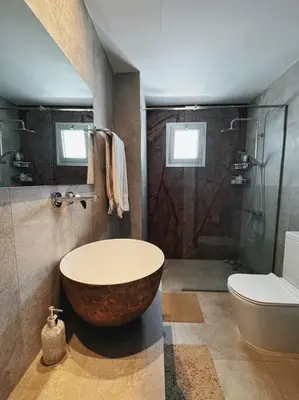 a bathroom with a large tub and a toilet at 3 Br Penthouse Jacuzzi Seaview in Limassol
