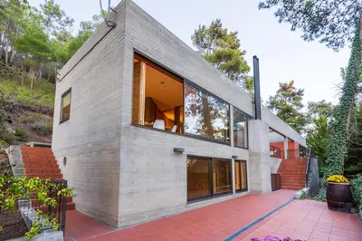 a house with a large window on the side of it at Paradise Peek, Platres in Platres