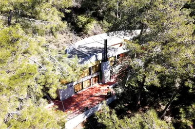 an overhead view of a building in the middle of a forest at Paradise Peek, Platres in Platres