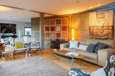 a living room with a couch and a table at Paradise Peek, Platres in Platres
