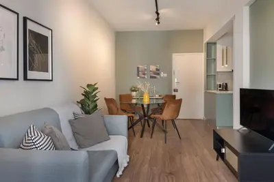 a living room with a couch and a table at Phaedrus Living Larnaca Tsimintia Retreat in Larnaka