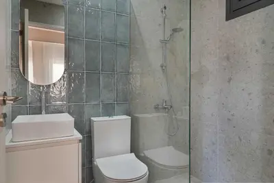 a bathroom with a shower and a toilet and a sink at Phaedrus Living Larnaca Tsimintia Retreat in Larnaka