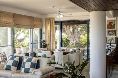 a living room with a couch and a table at Ayia Napa Sycamore SeaView in Ayia Napa