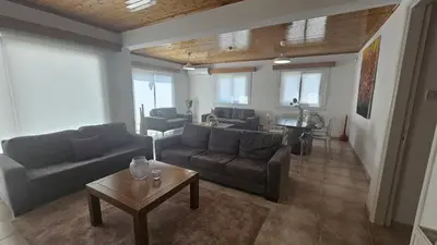a living room with a couch and a table at STAY Uptown Apartment in Engomi