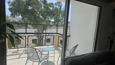 a view of a balcony with chairs and a table at STAY Uptown Apartment in Engomi