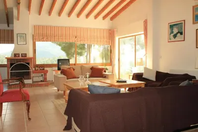 a living room with couches and a table at Villa in Moniatis in Moniatis