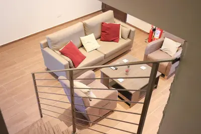 a living room with a couch with pillows on it at Marios Villa in Larnaka