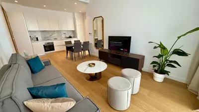 a living room with a couch and a table at Bali Residence Apt by TrulyCyprus in Limassol