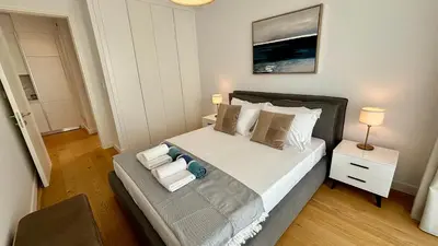a bedroom with a large bed with two pillows at Bali Residence Apt by TrulyCyprus in Limassol