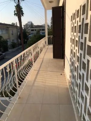 a walkway leading to a door on a balcony at Bougainvillea in Nicosia