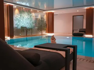 a swimming pool with a bed in the middle of it at Aqua House Valentino in Limassol