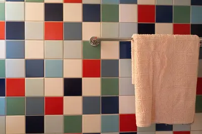 a towel hanging on a towel rack in a bathroom at ResArt Traditional House in Nicosia