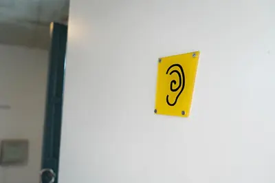 a yellow sign on the side of a door at ResArt Traditional House in Nicosia