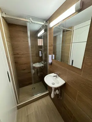 a bathroom with a sink and a shower at It can't be more central Larnaca in Larnaka
