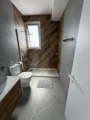 a bathroom with a toilet and a shower with a window at Theo luxury Napa villa in Ayia Napa