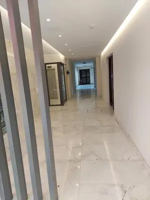 an empty hallway in a building with columns at Seafront City Center Studio in Limassol