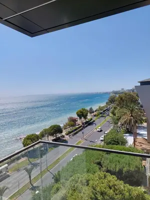 a view of the ocean from the balcony of a building at Seafront City Center Studio in Limassol
