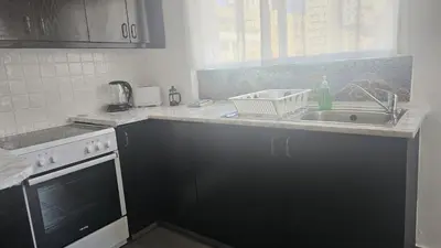 a kitchen with a sink and a counter top at STAY Limdream Apartment in Limassol