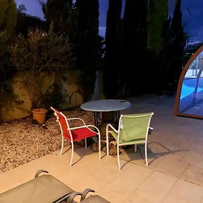 three chairs and a table and a table and chairs at Danitsea villa with privat pool in Psematismenos
