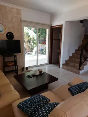 a living room with a couch and a coffee table at Danitsea villa with privat pool in Psematismenos