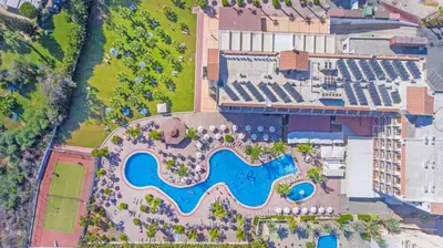 an aerial view of a resort with a swimming pool at Tsokkos Gardens Hotel in Protaras