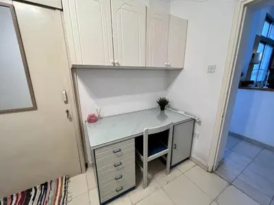 a white desk with a plant on it in a room at OLD Hostel in Limassol