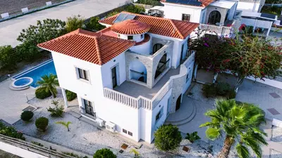 an overhead view of a white house with an orange roof at Beachfront Villa with Private Pool and Exotic Fruit Garden in Pyla