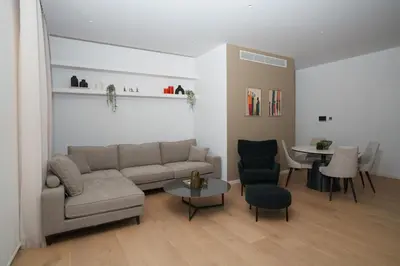 a living room with a couch and a table at WealthyStays Parkside Residence in Nicosia