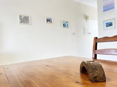 a wooden block on the floor in an art exhibit at Angela's Sunset Holiday Apt - Ayia Napa in Ayia Napa