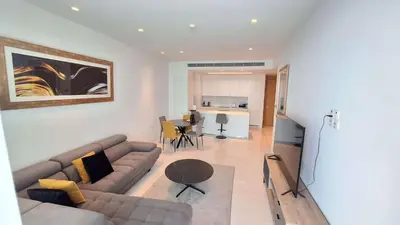 a living room with a couch and a table at Del Mar 2 bedroom Seaside 'A' Residence in Limassol