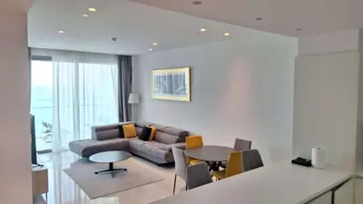 a living room with a couch and a table at Del Mar 2 bedroom Seaside 'A' Residence in Limassol