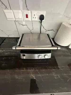 a laptop computer sitting on top of a table at Luxurious two bedroom apartment with roof garden in Kato Lakatamia