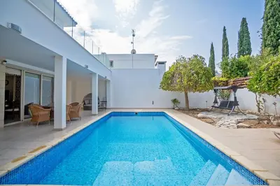 a swimming pool in the backyard of a house at Beachfront Villa Larnaka Dhekelia with Pool in Pyla