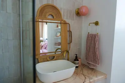 a bathroom with a sink and a mirror at Penthouse Living in the Heart of Nicosia in Nicosia