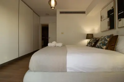 a bedroom with a large white bed in a room at Top Floor Gem: 3BR, Huge Veranda in Nicosia