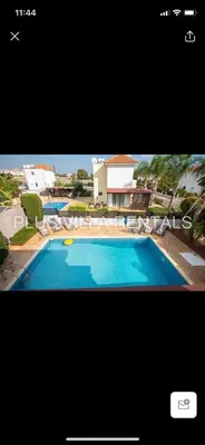 a picture of a swimming pool in front of a house at Villa 4 Ayia Thekla in Ayia Napa