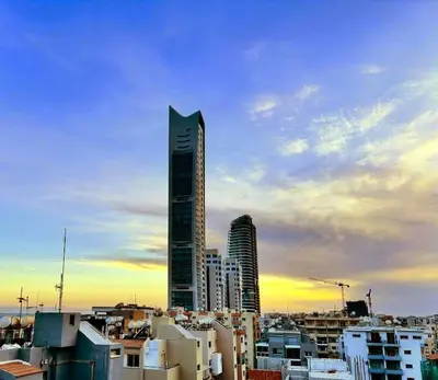 a view of a city with a tall building at Beautiful One Bedroom Apartment 100 Meters from the Beach, Recently Renovated in Limassol