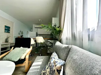 a living room with a couch and a table at Your place for relax in Larnaka