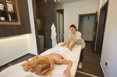 a woman laying on a bed in a room at The HEALTHY Stay-Padel, Pool&Fitness in Ayia Napa
