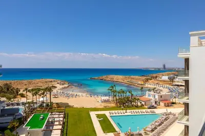 a view of the beach and the ocean from a building at The HEALTHY Stay-Padel, Pool&Fitness in Ayia Napa