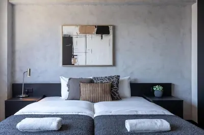 a bedroom with a bed with two pillows on it at The Penthouse - 3BR Seaview with Private Pool in Larnaca in Larnaka