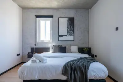 a bedroom with a large bed and a window at The Penthouse - 3BR Seaview with Private Pool in Larnaca in Larnaka