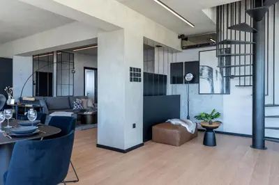 a living room with a couch and a table at The Penthouse - 3BR Seaview with Private Pool in Larnaca in Larnaka