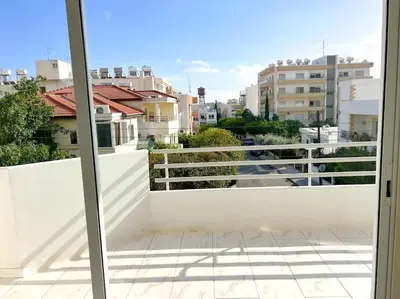 a balcony with a view of a city at Samos City Center, 2BR Sleeps 4 in Limassol