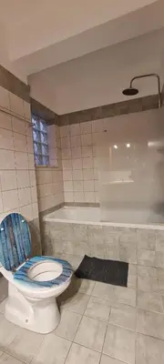 a bathroom with a toilet and a bath tub at Parlena Latsia in Laxia