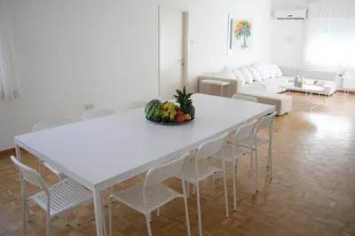 a white table with chairs and a bowl of fruit at Freshness Modern 2 Bedroom Apartment with Balcony & Stunning Sea View in Central Limassol in Limassol