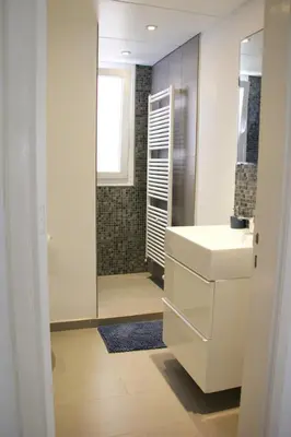 a bathroom with a sink and a shower with a mirror at Freshness Modern 2 Bedroom Apartment with Balcony & Stunning Sea View in Central Limassol in Limassol