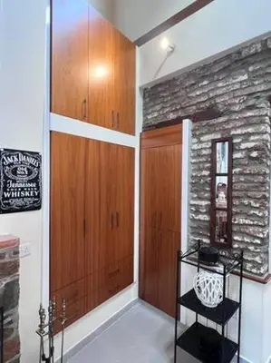 a room with wooden cabinets and a shelf in it at Finikous Cottage House-Agros in Agros