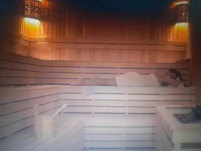 a person is laying in a sauna at Courtyard Holiday Resort Studio in Iskele