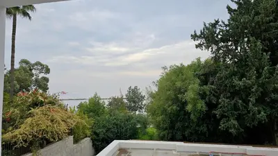 a view from the roof of a house with trees at Phaedrus Living Limassol Ocean Pearl Residence in Limassol